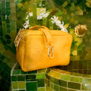 Bolso reptiliano mostaza